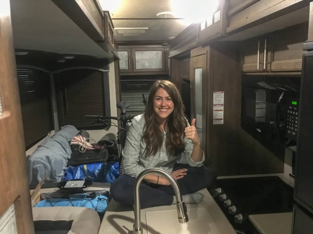 Cindy sitting in RV with slides in