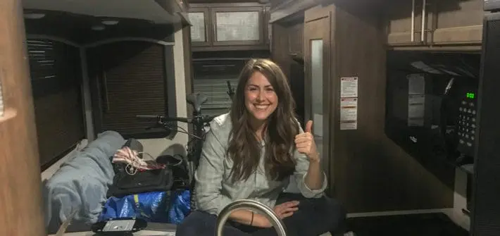 Cindy sitting in RV with slides in