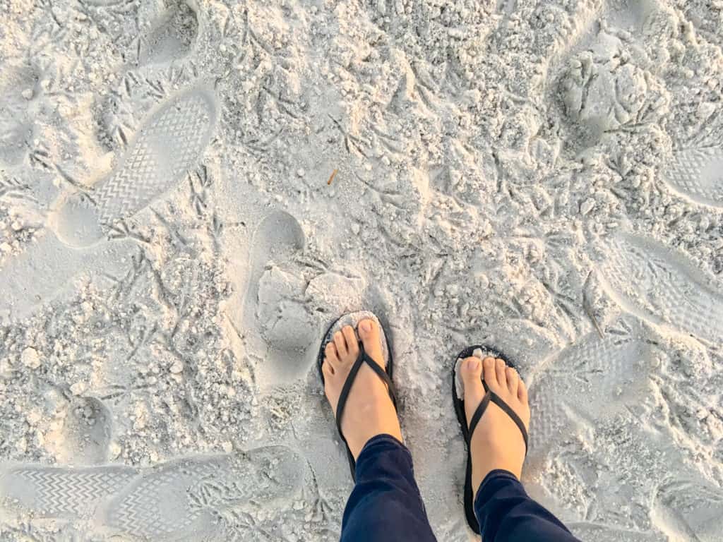 Feet in the sand at Fort Island Gulf Beach in Crystal River FL