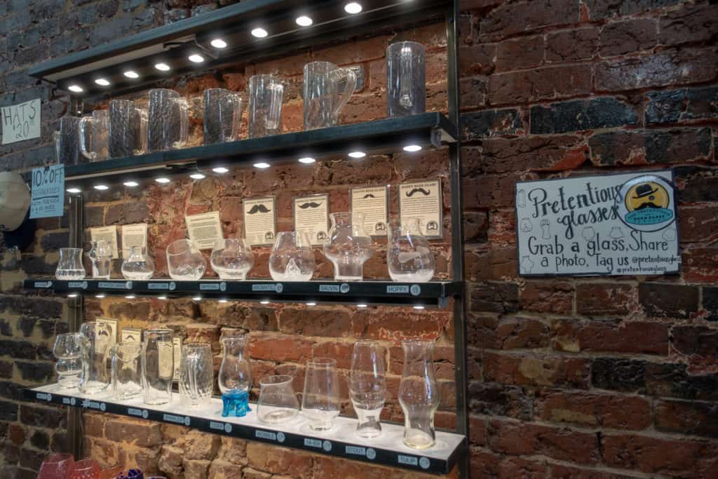 Glasses on display at Pretentious Glass Co, one of the best drink spots in Knoxville, Tennessee
