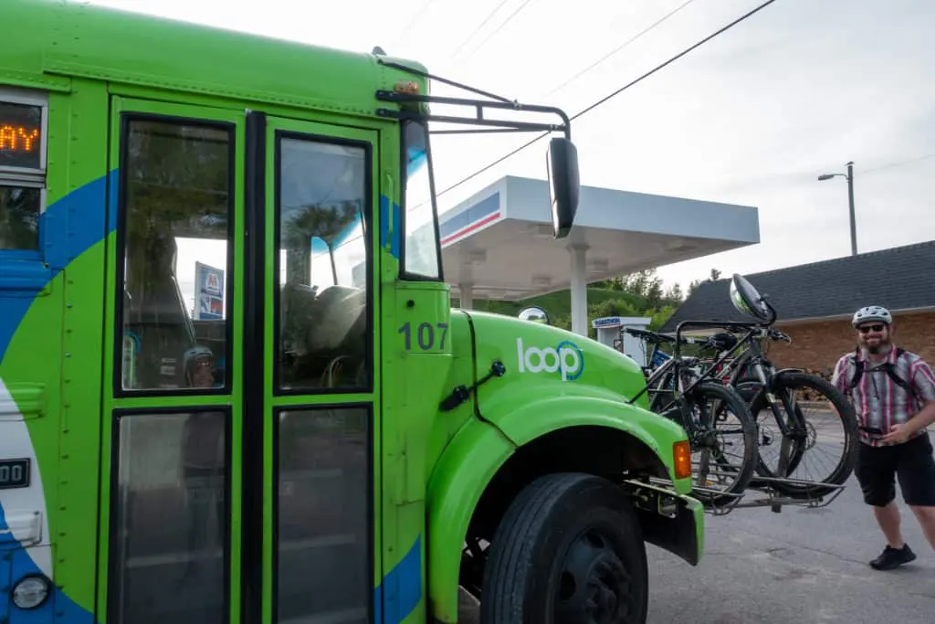 Barrett loading bikes back on the BATA bike-n-ride bus headed toward Traverse City