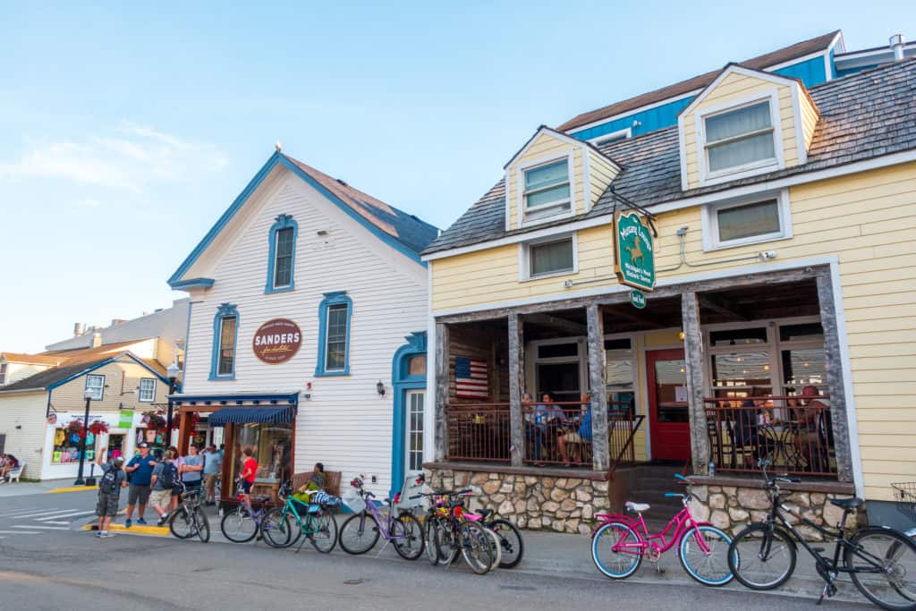 how-to-get-to-mackinac-island Tourists dining at the Mustang Lounge on Mackinac Island