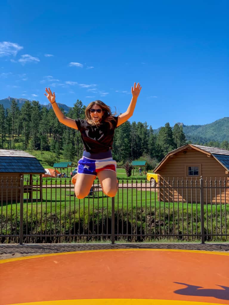 Cindy bouncing at the Mount Rushmore KOA at Palmer Gulch Resort