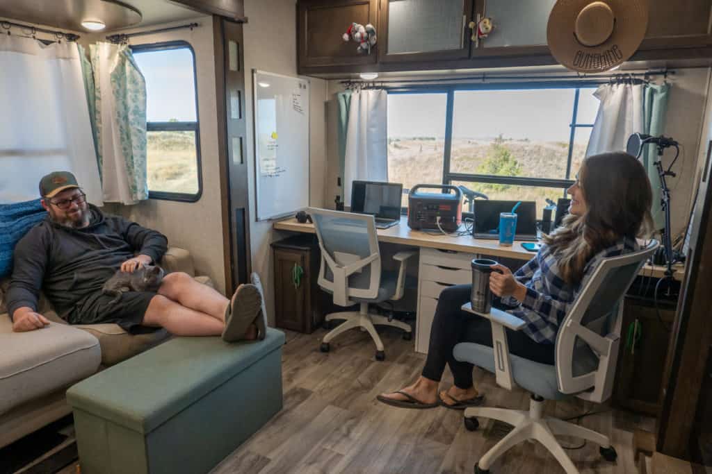 Cindy and Barrett inside their RV at their desk