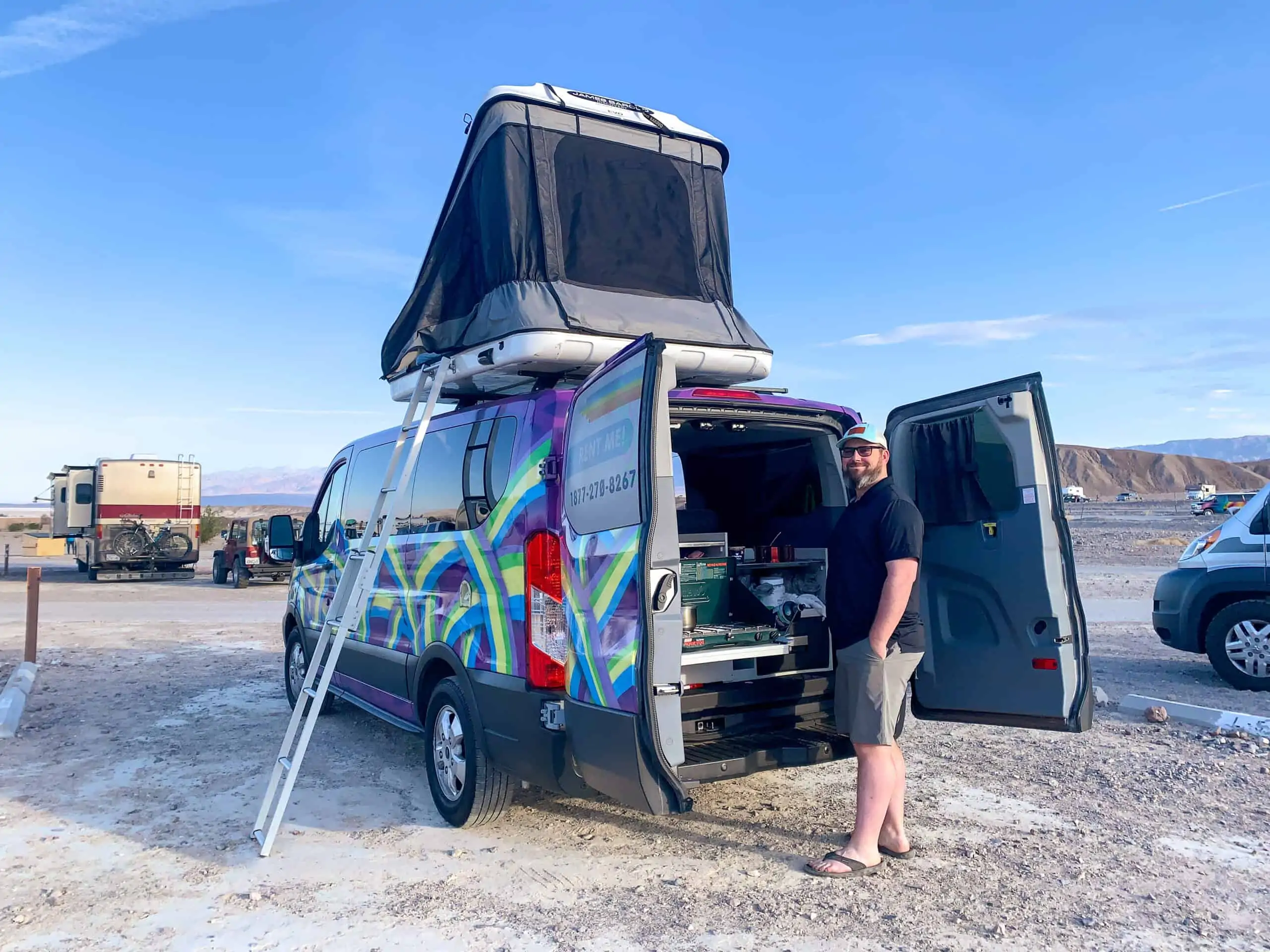 Barrett cooking breakfast in Death Valley National Park while comparing Van Life to RV Life