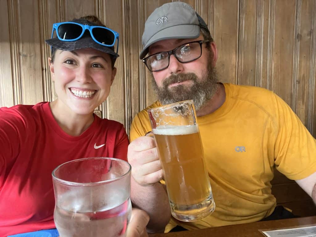 Cindy and Barrett enjoy drinks while hiking the Appalachian Trail.