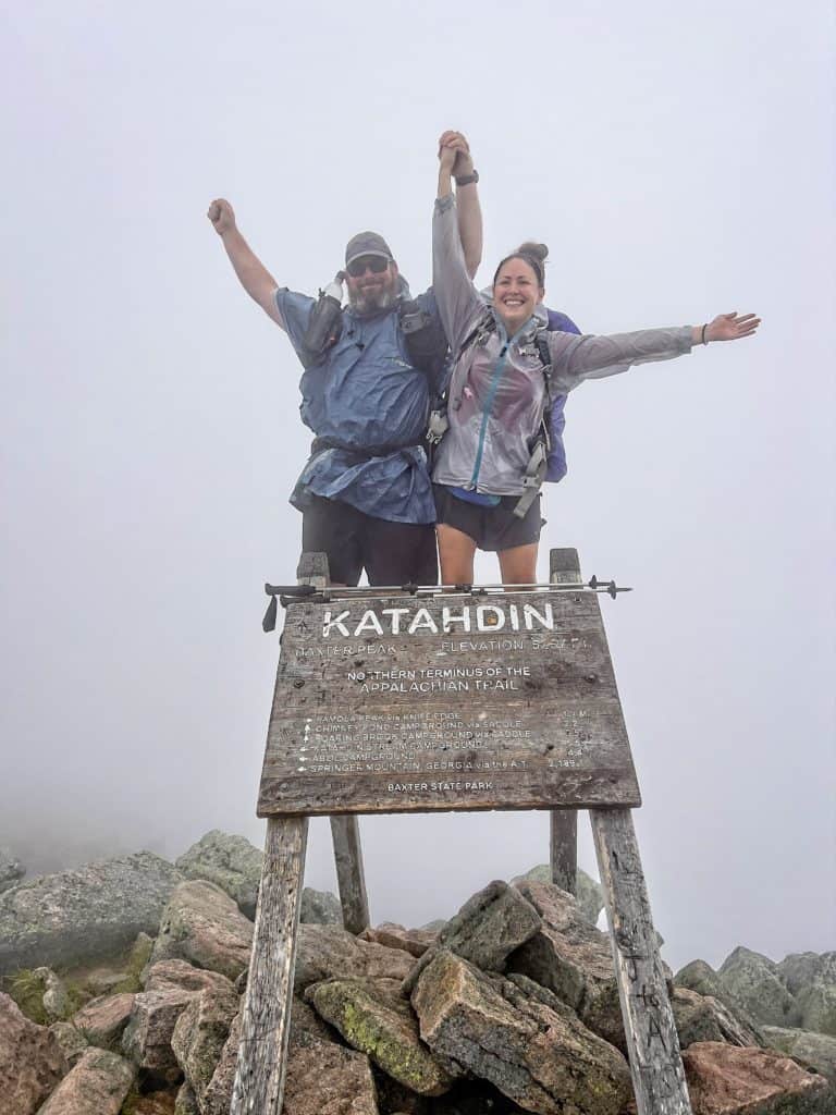 Cindy and Barrett are at Katahdin wearing Frogg Toggs rain gear from the Appalachian Trail gear list.