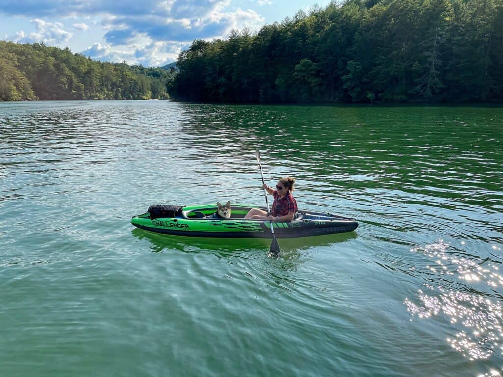 Cindy and her dog Marty kayaking in an inflatable kayak
