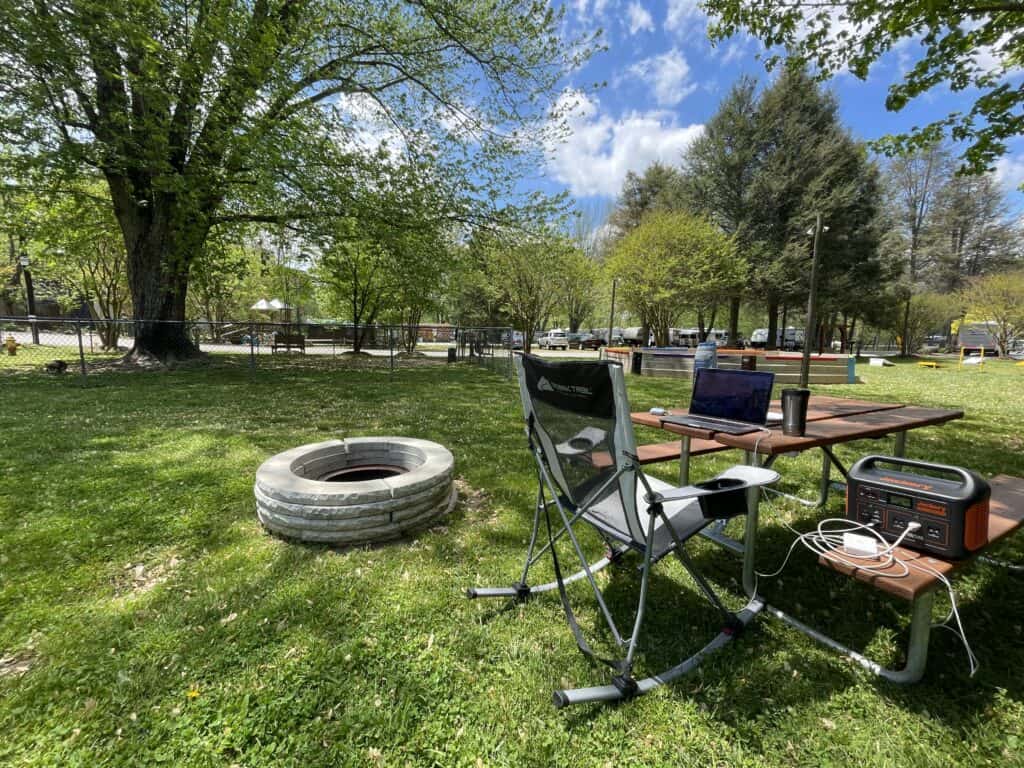 Working at a campsite from a Rocking Camping Chair, an RV must have