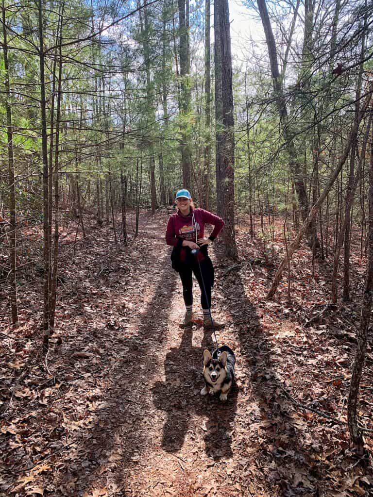 Cindy on a hiking for beginners trail with her dog Marty.
