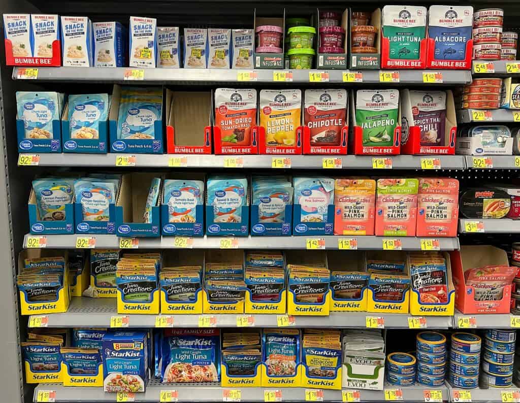 packets of tuna in a shop being sold as food for hiking options