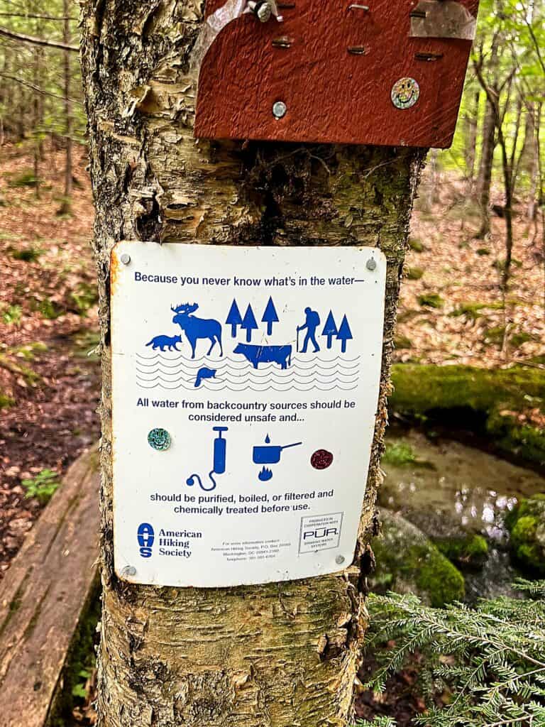 sign about filtering water while hiking