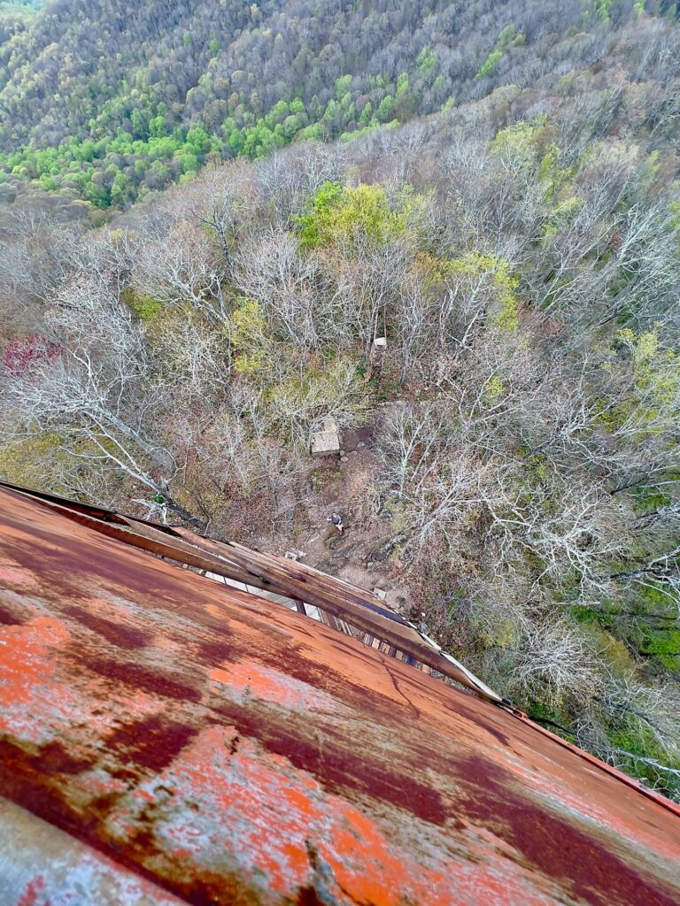 hiking the appalachian trail Barrett on ground below firetower