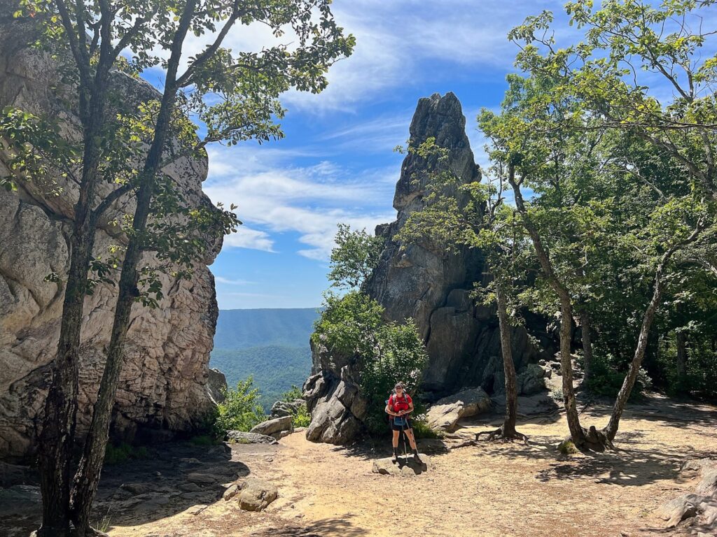 Cindy hiking the Appalachian Trail at Dragon's Tooth