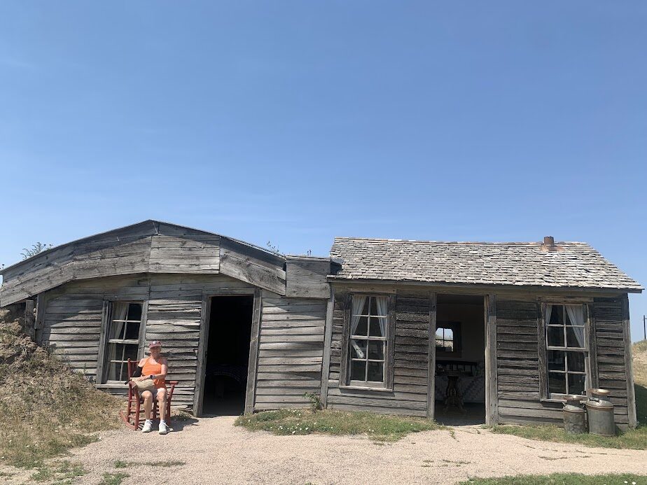 My mom outside the Prairie Homestead.